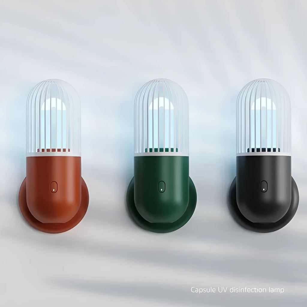 Compact portable UVC disinfection lamp in capsule design showing black, brown, green, and white colour options.