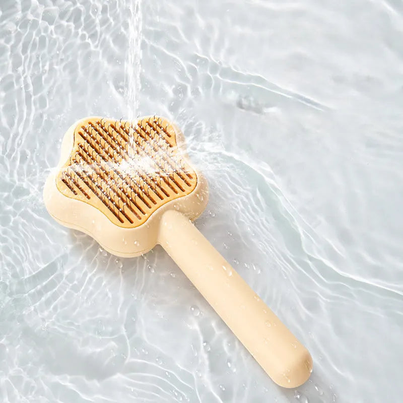 Green cat grooming comb with stainless steel needles and self-cleaning feature, 20cm length