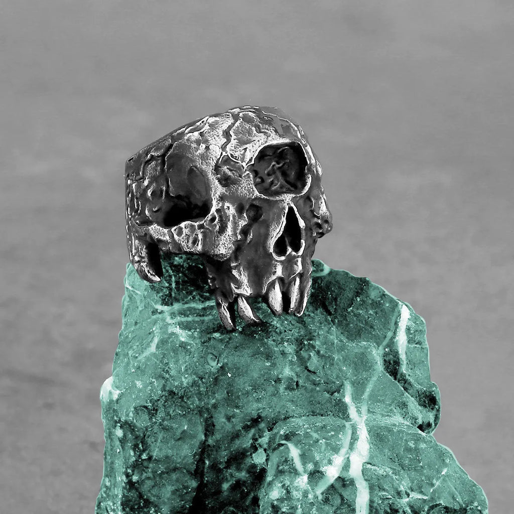 Alloy skull ring with one-eyed design and electroplated finish, shown in UK sizes 7-13 for retro punk style