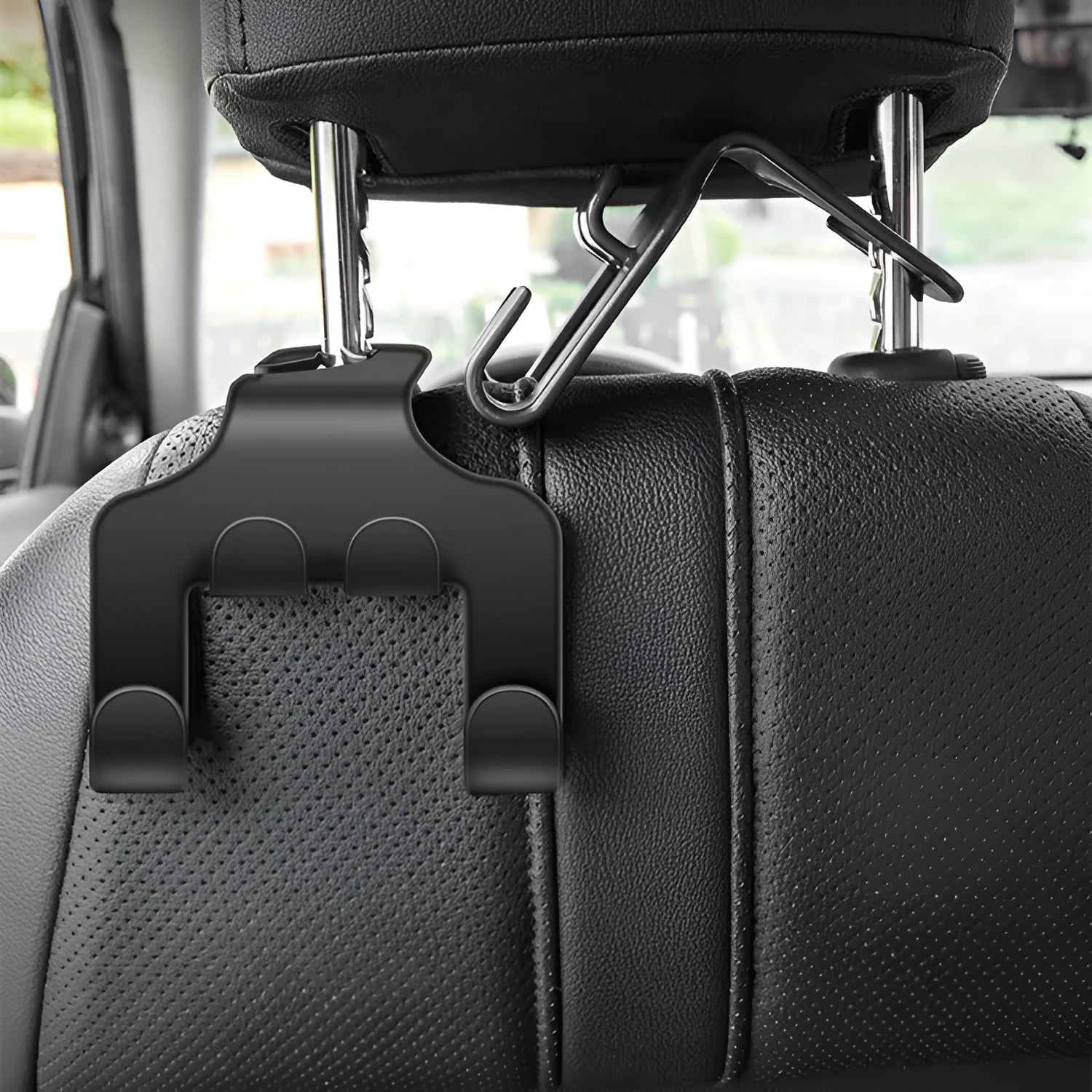 Two white ABS plastic car multifunction holder hooks mounted on a car dashboard.
