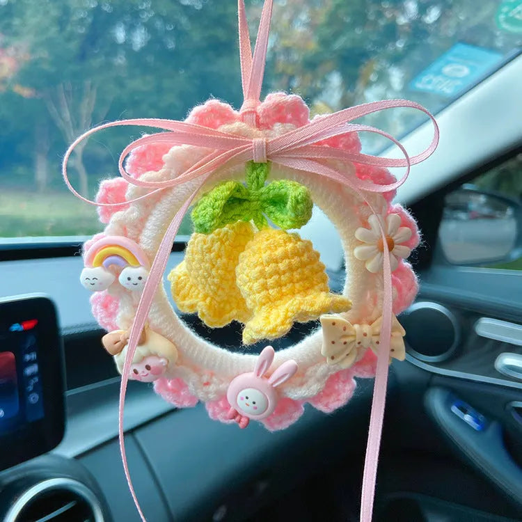 Handwoven wool bell orchid car pendant hanging from rear-view mirror with green colour option