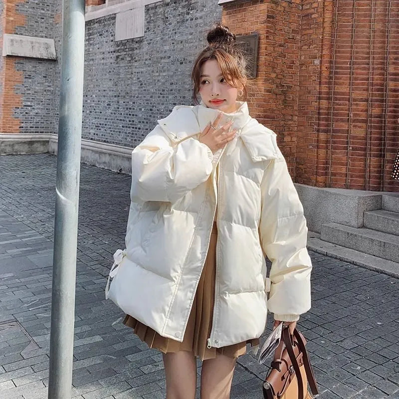 Milky white women's sleeveless loose cotton-padded jacket with princess sleeves on a hanger.