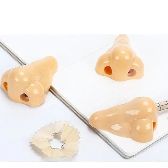 Flesh colour pencil sharpener with 58x45x30mm geometry shape and big nostril design for student stationery