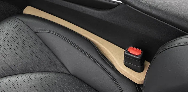 Two waterproof polyresin car seat gap filler strips with handles in beige colour