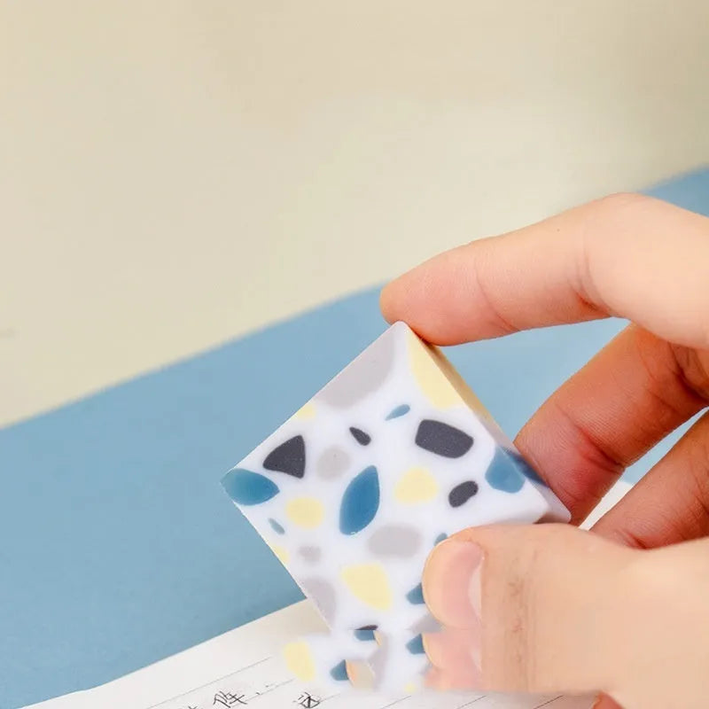 Super Clean Traceless rubber eraser with a brick shape for student stationery.