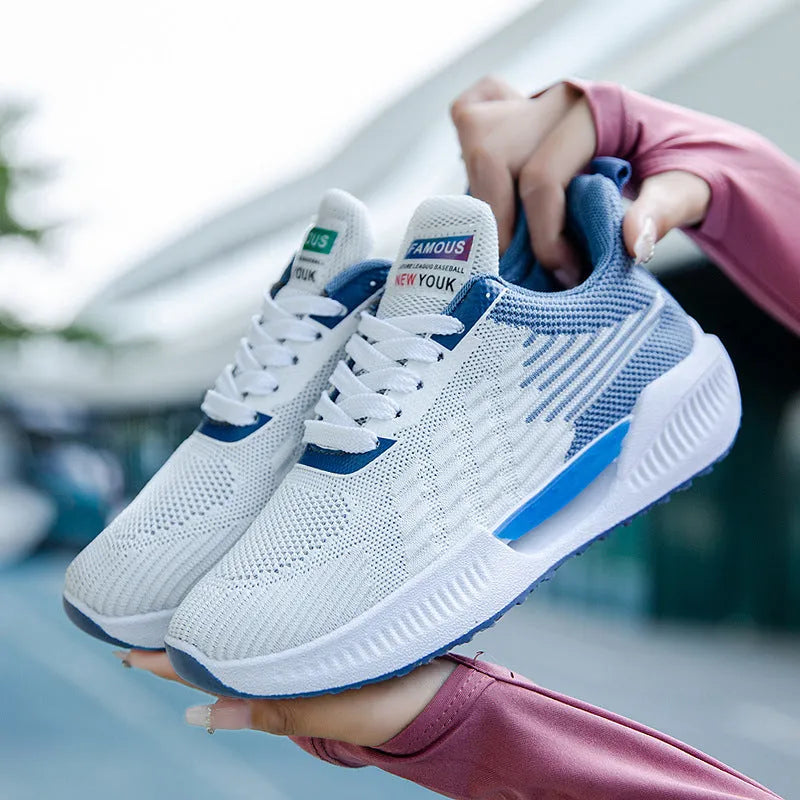Men's blue casual mesh shoes with cloth upper and injection-moulded plastic sole on grey background