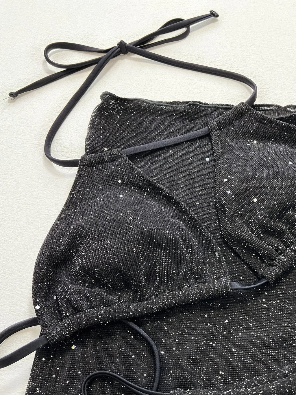 Black three-piece swimsuit set with top and shorts in polyester fibre, showing Asian sizing specifications
