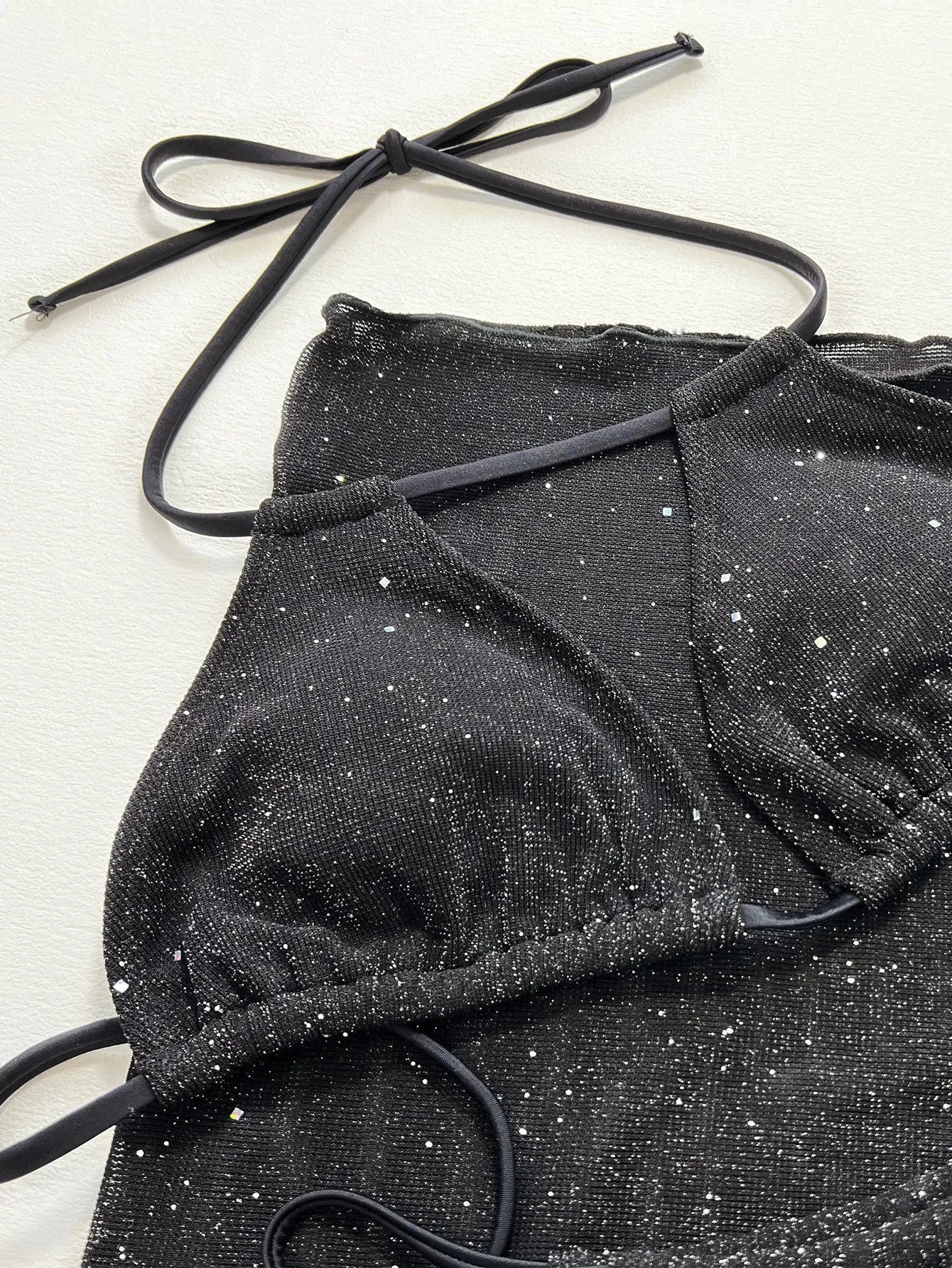 Black three-piece swimsuit set with top and shorts in polyester fibre, showing Asian sizing specifications