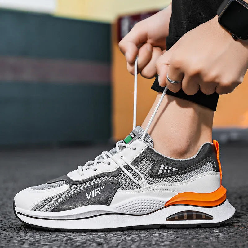 Men's gray breathable mesh running shoes with EVA sole and sewing thread details on upper
