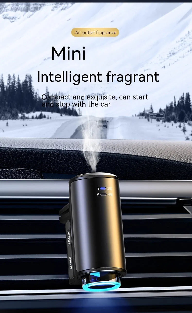 Obsidian black car vent clip aroma diffuser with essential oil bottle on a car air vent.