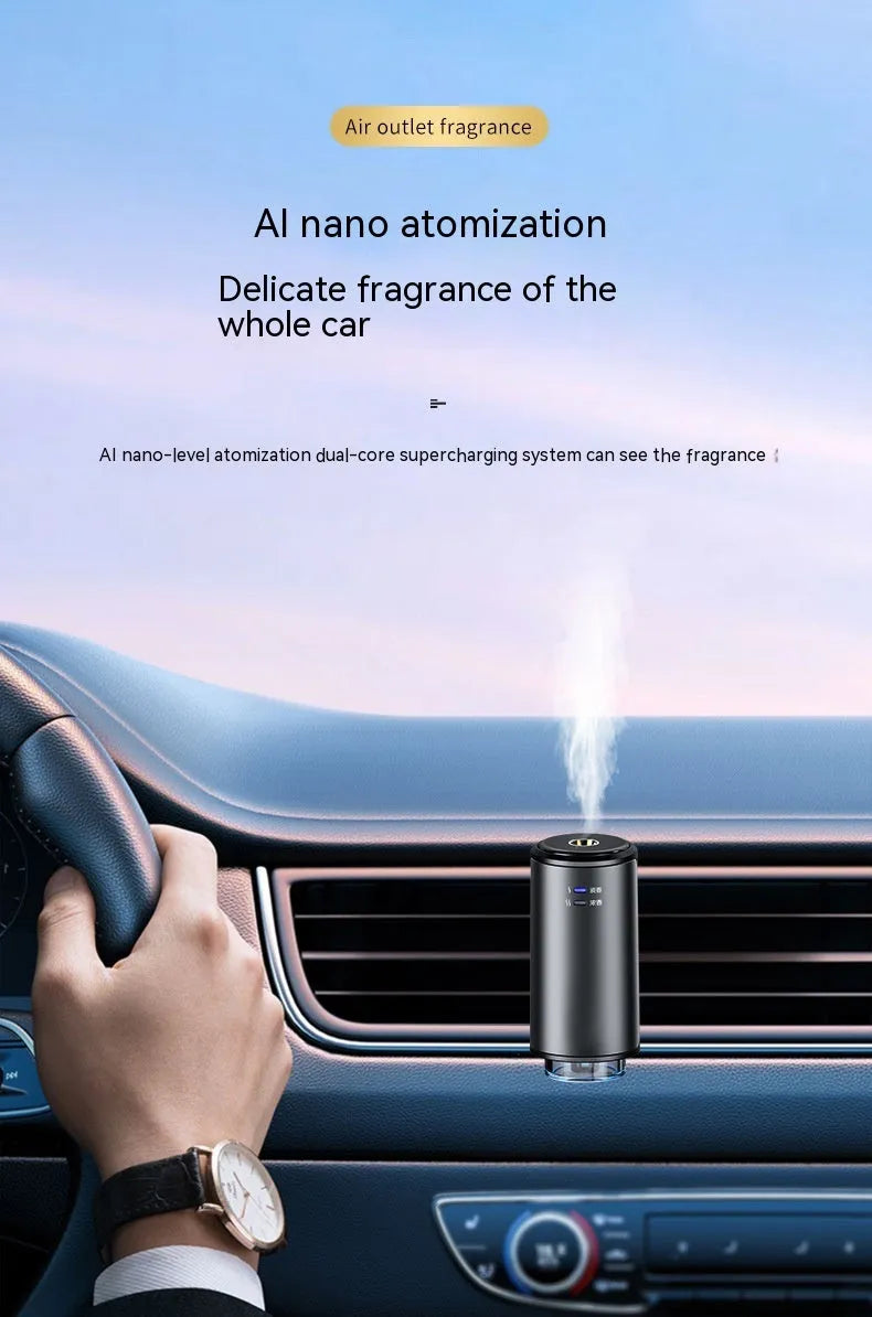 Obsidian black car vent clip aroma diffuser with essential oil bottle on a car air vent.