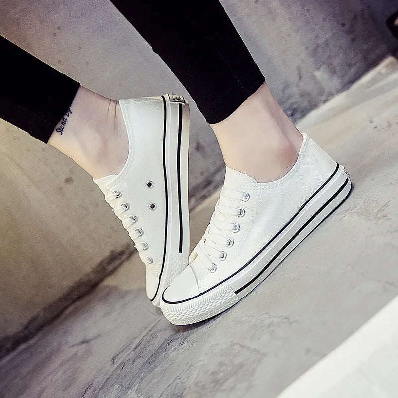 Women's canvas shoes in solid colours with canvas upper, sizes 35-44, on a neutral background.