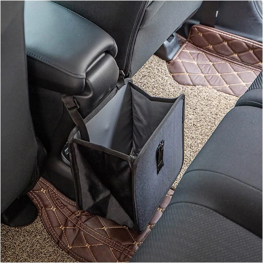 Black Oxford cloth car hanging trash can with hanging loops, shown unfolded.