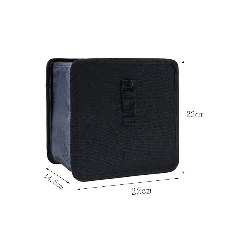 Black Oxford cloth car hanging trash can with hanging loops, shown unfolded.