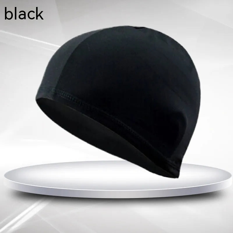 Black unisex adult polyester cloth swimming cap laid flat.