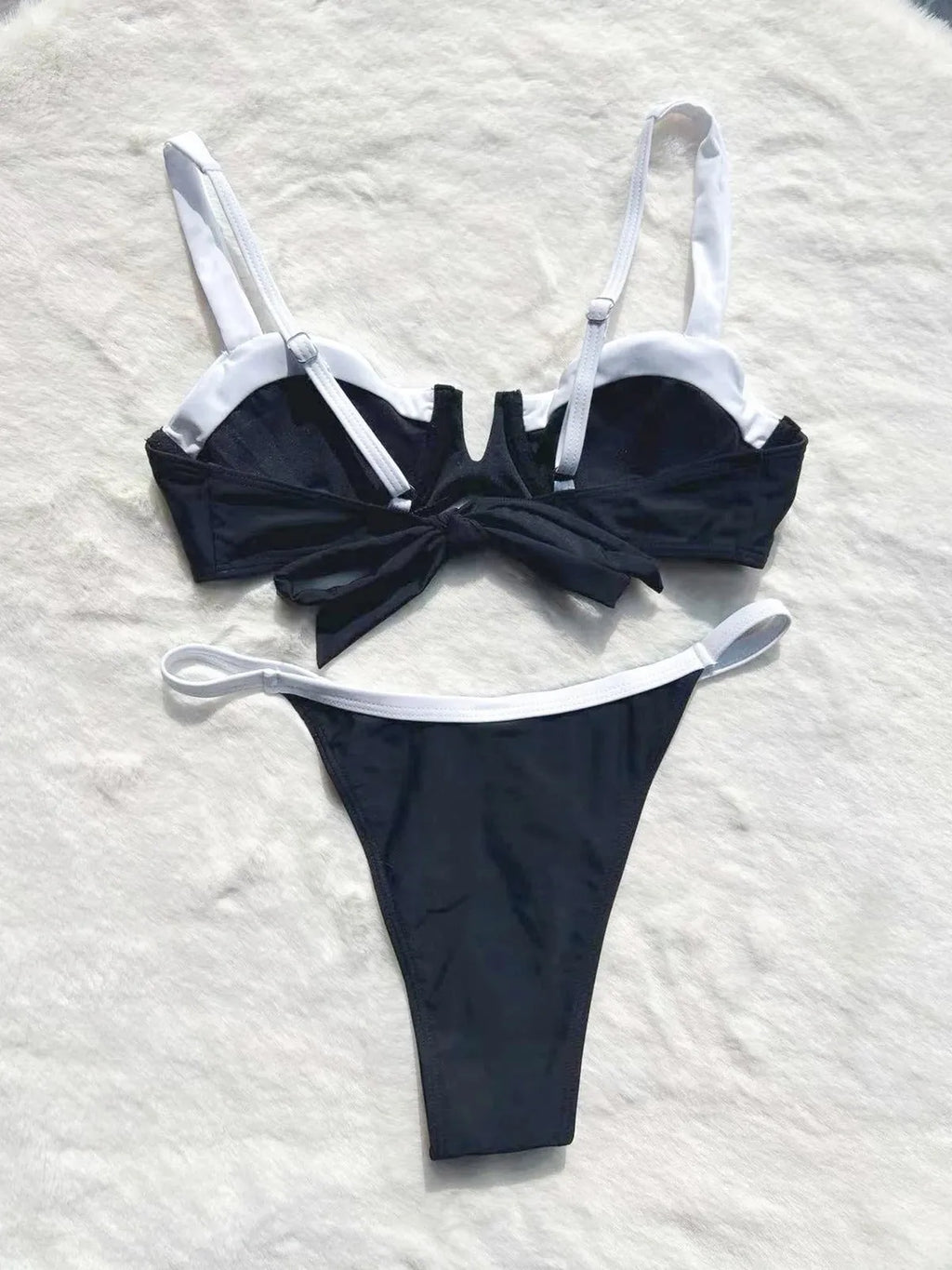 Black women's low waist bikini swimsuit with stitching split detail on brief style