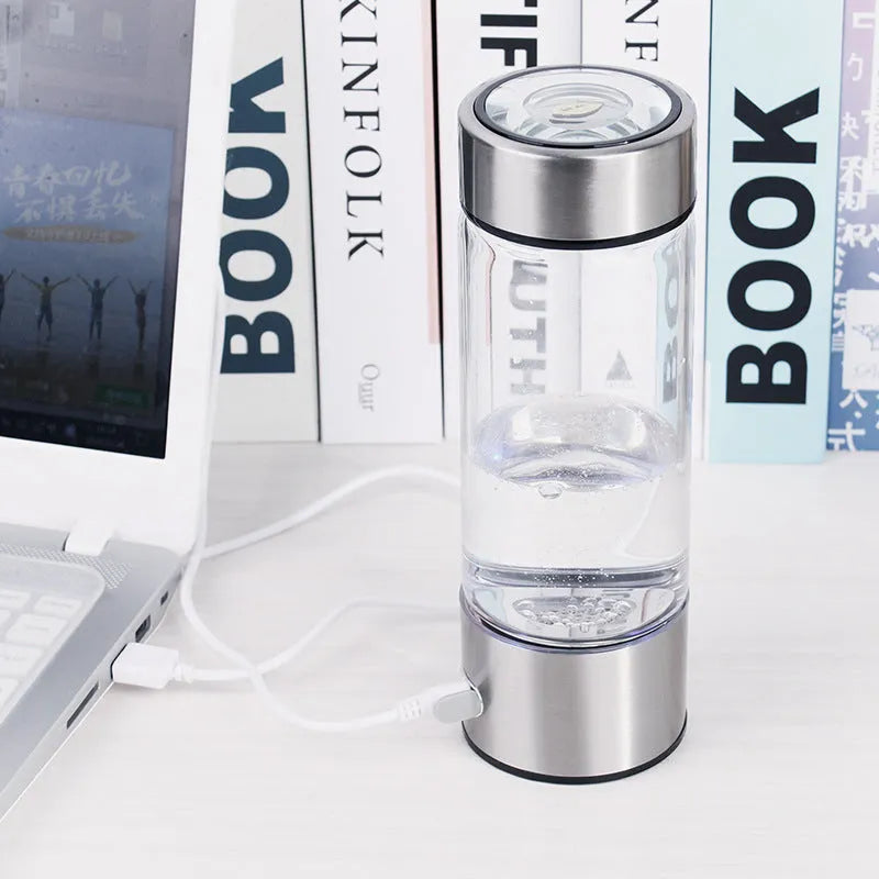 Hydrogen water bottle with borosilicate glass cylinder and electric hydrogen generator in silver colour