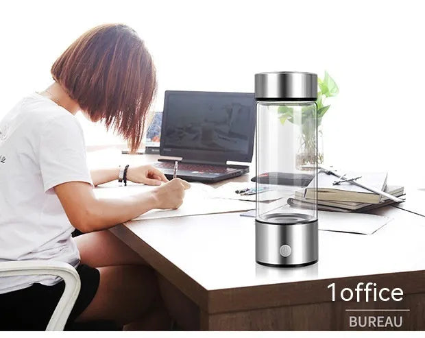 Hydrogen water bottle with borosilicate glass cylinder and electric hydrogen generator in silver colour
