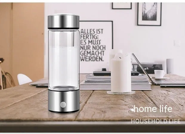 Hydrogen water bottle with borosilicate glass cylinder and electric hydrogen generator in silver colour