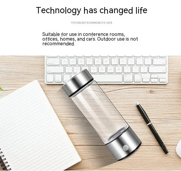 Hydrogen water bottle with borosilicate glass cylinder and electric hydrogen generator in silver colour