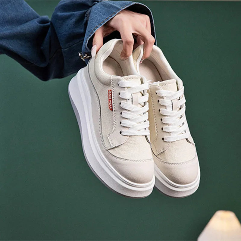 Women's beige and pink leather board shoes with a thick sole, shown from the side.