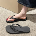 PVC women's flip flops in pink with a non-slip sole and toe-covering strap.