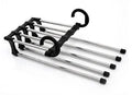 Black stainless steel 5-in-1 multi-functional trousers hanger with five booms on a clothes rack