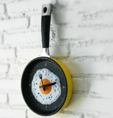 Boiled egg pot wall clock with 10mm plastic shell, coated glass mirror, PVC dial, and electronic movement.