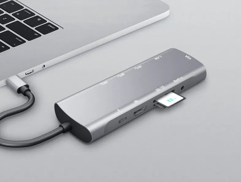 Grey USB-C docking station with HDMI, VGA, USB ports, and 140mm cable for laptop connectivity expansion