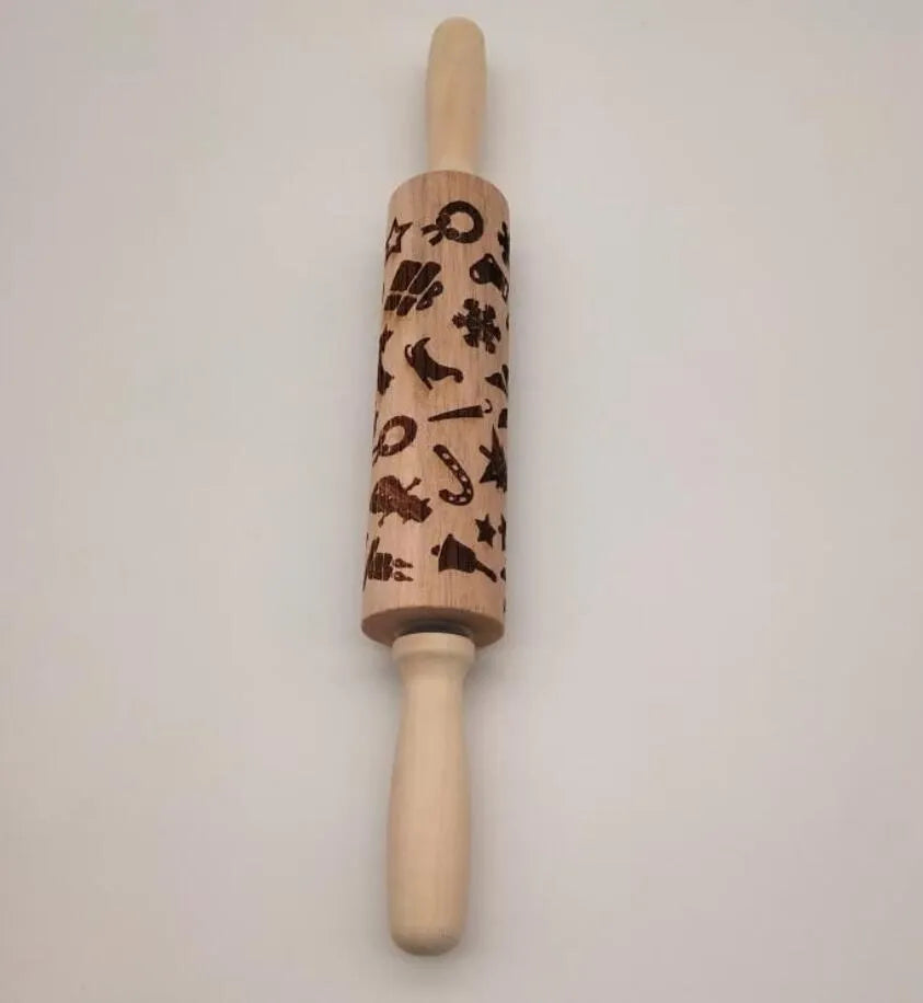 Solid wood rolling pin with embossed Christmas reindeer pattern on a 45cm long shaft.