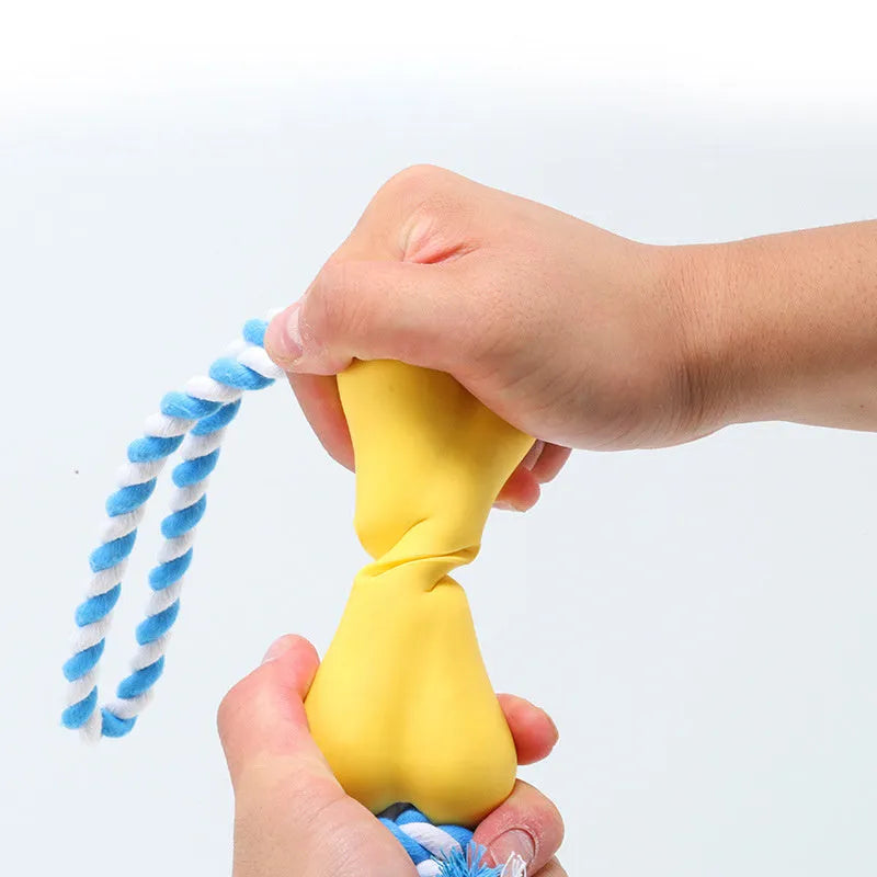 Green porous bone-shaped dog toy with rope knot texture for treat stuffing and teeth cleaning