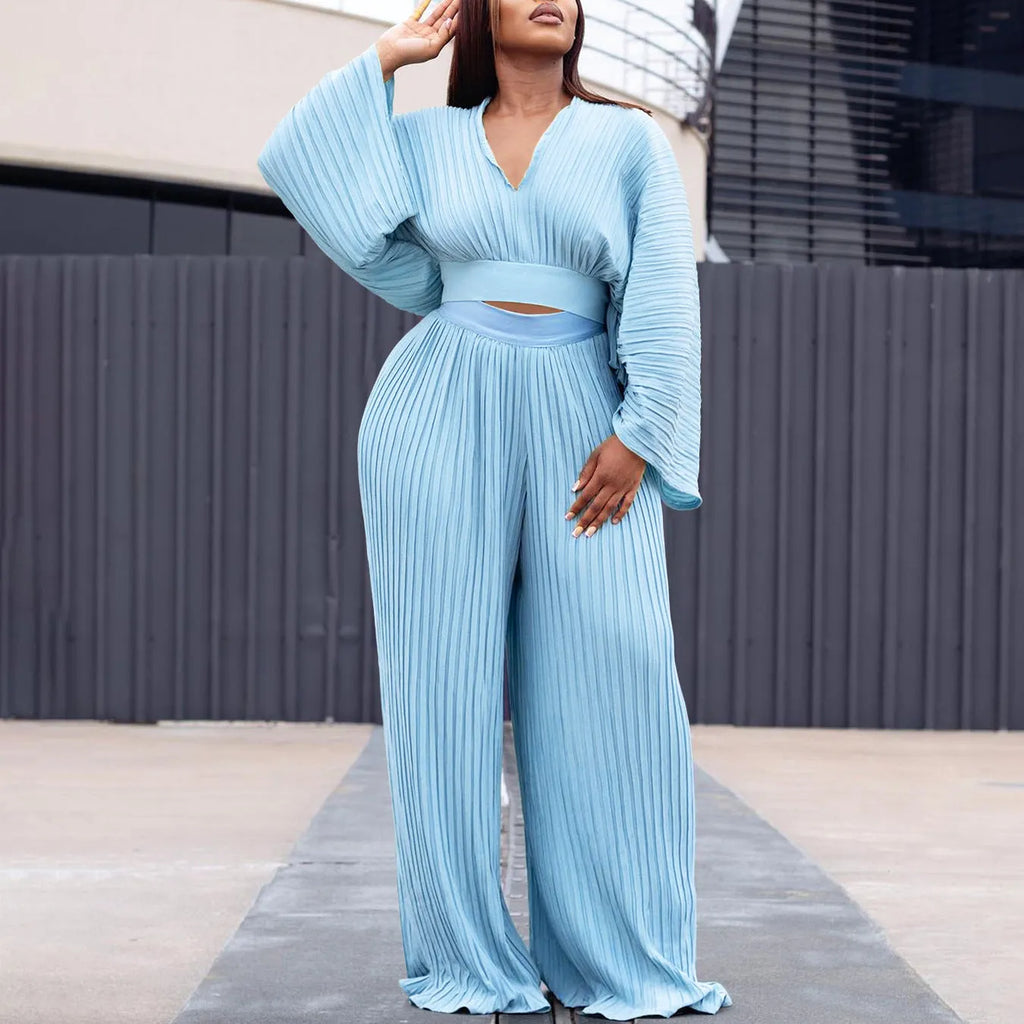 African suit two-piece set featuring a batwing sleeve top and wide-leg trousers in red or sapphire blue.