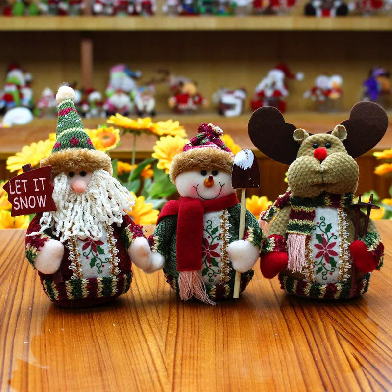 Set of three red green and white flannel Christmas figures: snowman, reindeer and Santa Claus.