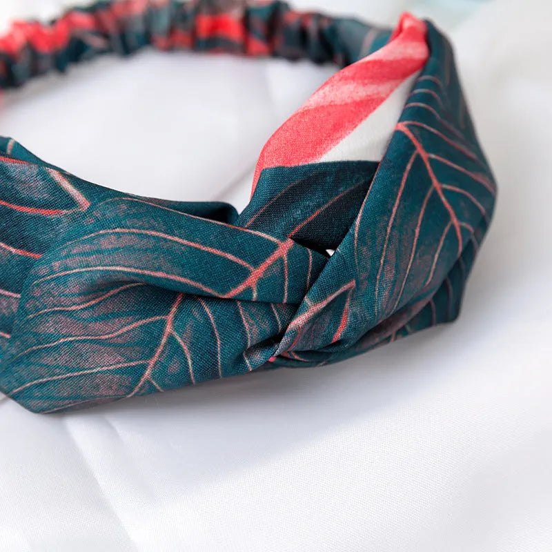 Red cloth women's headband with banana leaf cross design for hair management