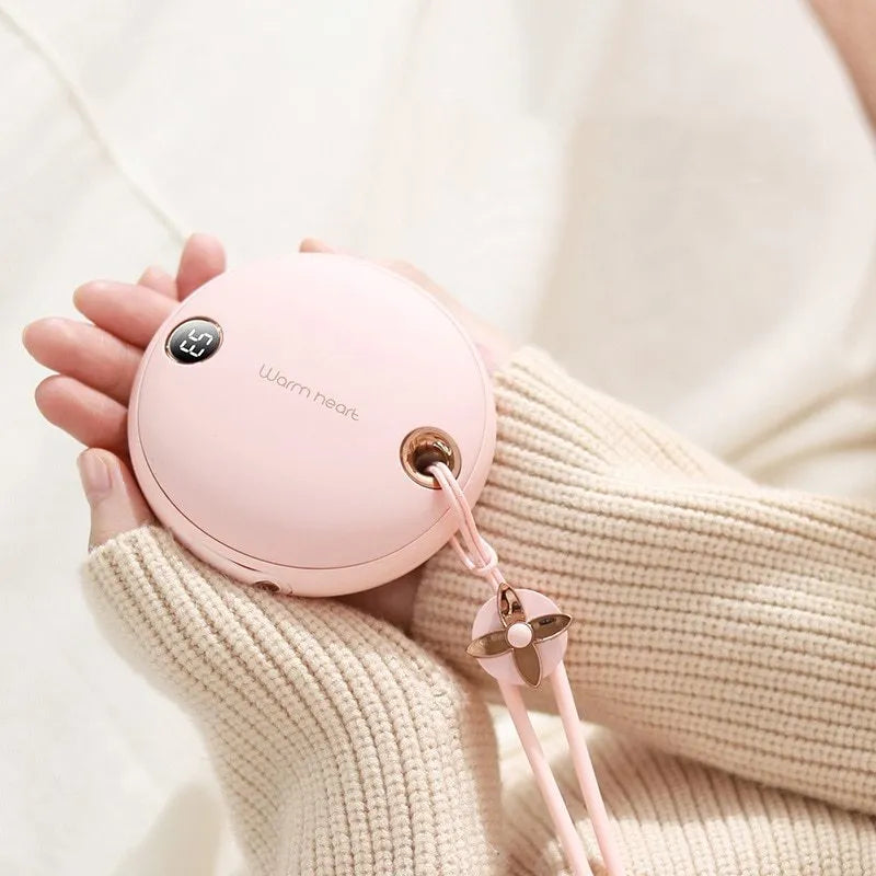 Green hand warmer power bank showing digital display with 5000mAh capacity and Type-C port