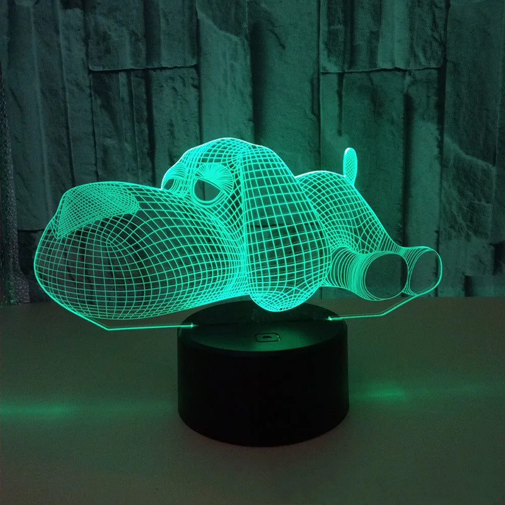 Doggo shaped 3D illusion desktop lamp glowing in multiple colours on a desk.