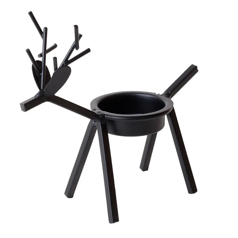 Black iron Christmas deer candlestick holder with Santa and snowman designs, 15cm height