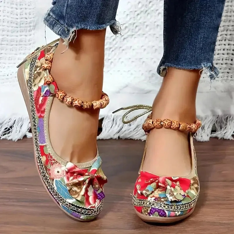 Black and red women's plus-size ethnic platform sandals with a cloth upper and elastic band.