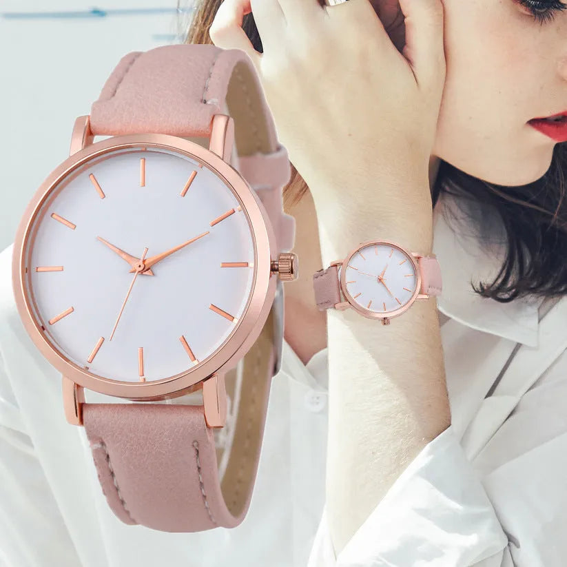 Square-faced quartz watch with an alloy case and a PU leather strap on a wrist.