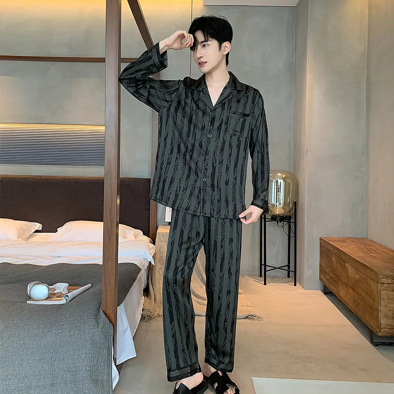 Men's black striped ice silk pajama two-piece set with V-neck top and long trousers.