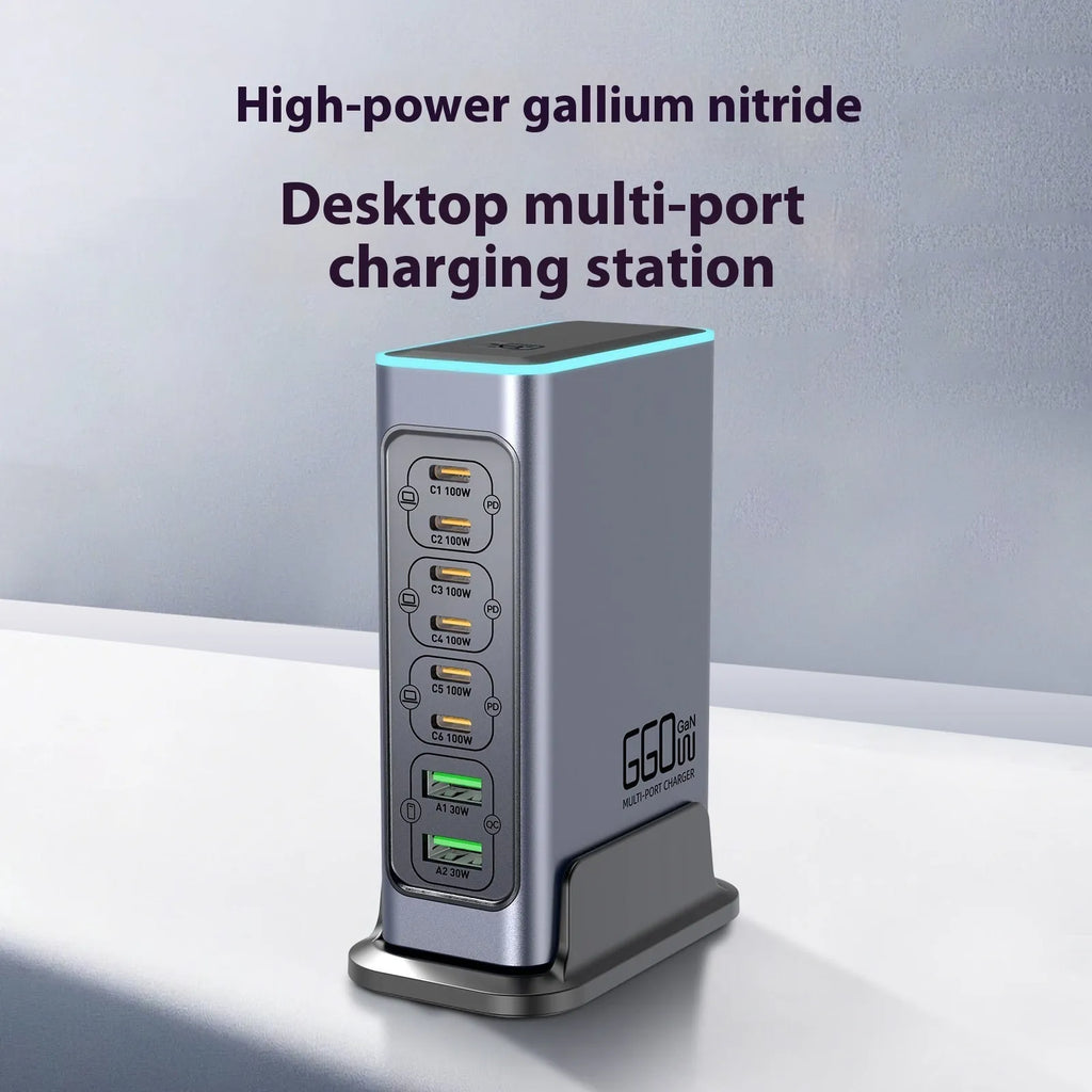 660W GaN desktop charger with five ports and interchangeable plugs for AU, EU, UK, US sockets on a desk