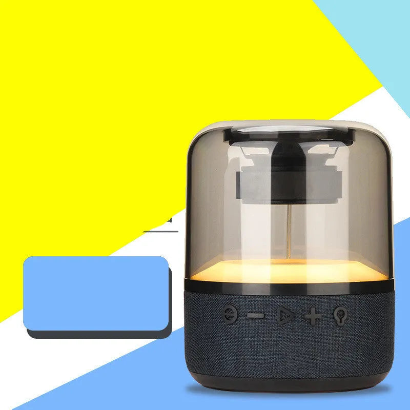 Black wireless Bluetooth speaker with 360-degree sound, compact design, and mechanical keys for control