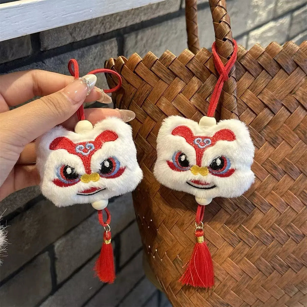 Handmade blue plush lion keychain ornament with star stone accent and embroidered cartoon features