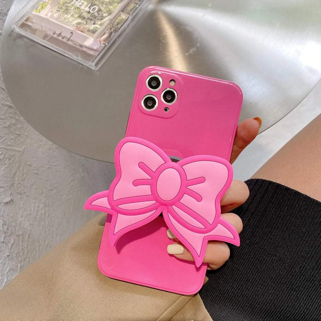 Rose Red iPhone case with pink bow design and a folded-out kickstand on the back.