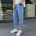 Men's loose straight harem jeans in black or blue, showing relaxed fit and straight leg opening, suitable for casual occasions.