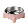 Green stainless steel pet bowl with non-slip base and high foot on a wooden floor.