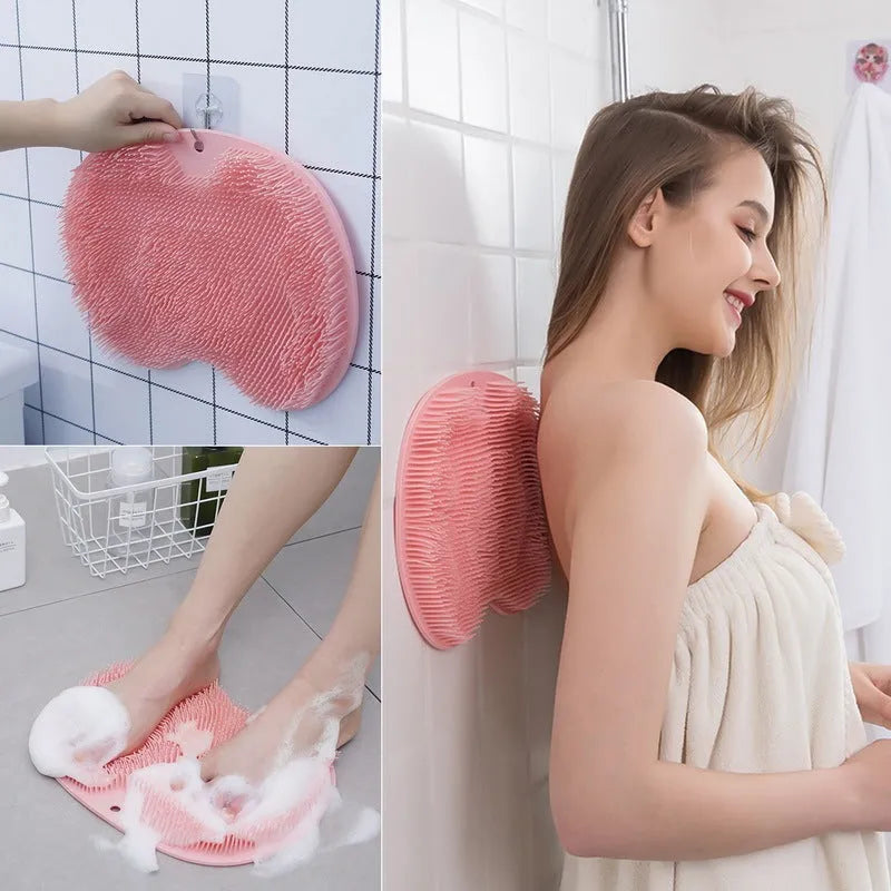 Orange massage bath brush with suction cups and silicone bristles on a 23x30cm TPR mat