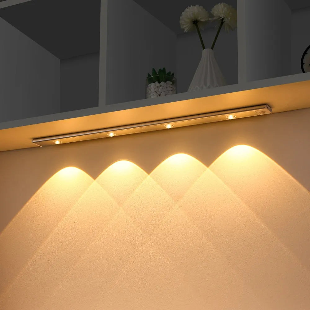 Ultra-thin USB LED night light with motion sensor in silver or black, showing magnet attachment for cabinets
