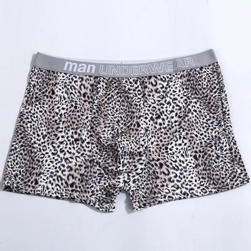 Men's leopard print underwear in milk silk polyester fabric showing loose fit and mid waist design
