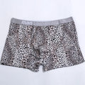 Men's leopard print underwear in milk silk polyester fabric showing loose fit and mid waist design